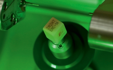 Fig. 8 The highly translucent, hybrid ceramic block in the color 2M2 clamped in the grinding machine.