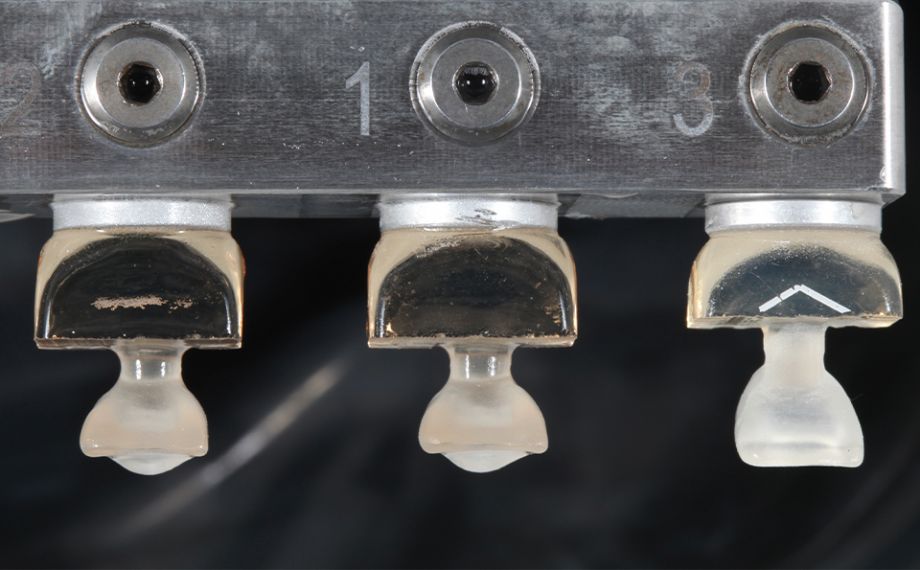 Fig. 2 The CAD/CAM-fabricated crown in the middle immediately after the milling.